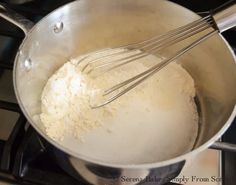 a pan filled with flour on top of a stove