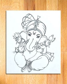 an elephant is sitting on the floor in front of a piece of paper