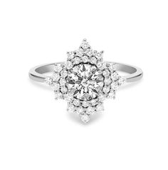 This stunning engagement ring is studded with certified conflict-free natural diamonds. Crafted in 14K solid gold. Total Carat weight: 0.8 carats. Focal stone clarity options: SI1. Focal stone color: G/H. Center diamond carat weight: 0.5 carats. Focal stone cut: Good. Side diamonds weight: 0.30 carats. Side diamonds clarity and color: SI, G-H. Number of accent diamonds: 61. Customizable in metals of choice. Band width: 1.8 mm. Designed in Austin, Texas. Looking for more diamond options? We have Floral Halo, Stunning Engagement Ring, Lab Grown Diamonds Engagement, Natural Diamond Engagement Ring, Signature Jewelry, Jewelry Rings Diamond, Diamond Carat, Fine Jewelry Designers, Brilliant Diamond