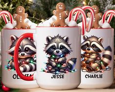 two coffee mugs decorated with christmas lights and raccoons