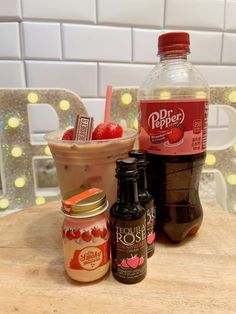 two bottles of iced coffee sit next to each other on a table