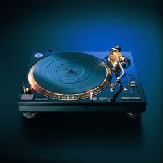 a turntable sitting on top of a blue table