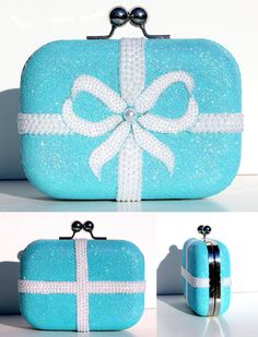 Set yourself apart from the rest with this eye-catching and unmistakable Tiffany inspired blue glitter clutch accented with Swarovski crystals and pearls that delivers a dazzling sparkle in the palm of your hand. Paired with our Tiffany Heels you cannot go wrong. Disclaimer: The clutch we use as a base can be changed at anytime and replaced by a similar hand bag. We will notify you if this happens and will work with you on a replacement that suits your needs best! Please inbox us with any questi Blue Glitter Heels, Blue Luggage, Purse Ideas, Crystal Handbag, Perfect Wedding Shoes, Glitter Clutch, Blue Clutch, Crystal Heels, Bag Obsession