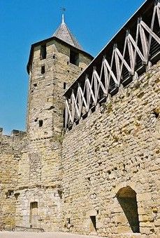 an old stone castle with a clock tower