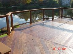 there is a wooden deck overlooking the water