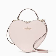 This is for a Brand New in Original Packaging and with Tags 100% Authentic Kate Spade New York Love Shack Heart Purse (Style #wkr00339) in Chalk Pink. This crossbody is perfect if you want to carry your important things without all the bulk.  Plus, your hands are free to keep up with all your group texts and grip that vanilla latte. Saffiano PVC Two-way Spade jacquard lining KSNY metal pinmount logo Crossbody with zip around closure Six credit card slots Interior front slip pocket 7.5"h x 8.25"w x 2.375"d Handle drop:  2.5" Strap drop:  22" Dust bag not included Imported Please see our other items for combined shipping.  Thank you. Cute Pink Purse, Kate Spade Bag Aesthetic, Kate Spade Purse Aesthetic, Kate Spade Heart Purse, Kate Spade Heart Bag, Kate Spade Pink Purse, Pink Designer Bags, Pink Kate Spade Bag, Pink Purses