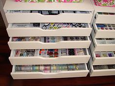 the drawers are organized with craft room items