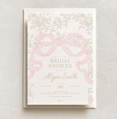 a wedding shower card with pink ribbon on it