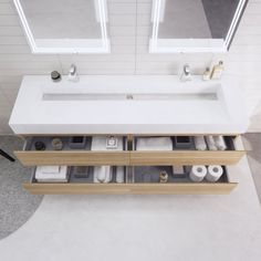 a bathroom sink with two drawers underneath it