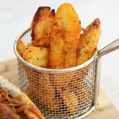 the best crispy potato wedges are in a basket next to a hot dog