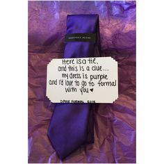 a purple tie with a note attached to it that says, there is no life and this is a clue