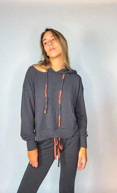 In need of the perfect lounge-wear hoodie for the winter months? Look no further with the Bea Dyed Drawstring Slash Neck Hoodie in charcoal. This hoodie features a super soft material, a cutout on the neckline, and tie dye drawstring detailing so you will be sure to look your best and feel your best too! Pair with the matching Bea Dyed Drawstring Jogger to achieve the ultimate cozy look. Cut Out Hoodie, Quick Coffee, Winter Must Haves, Coffee Run, Drawstring Jogger, Neck Hoodie, Winter Months, Soft Material, The Winter