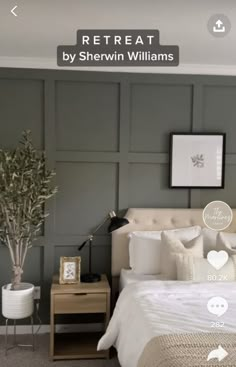 the bedroom is decorated in shades of gray and white