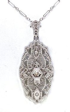 "Vintage Art Deco design, diamond, and white gold necklace. Beautiful pendant with a round diamond center weighing approximately .04 ct. and accented with 10 single cut diamonds with an approximate total weight of .08 ct. The pendant hangs on a hand made white gold chain. This necklace weighs approximately 3.8 grams and is stamped \"14K ESEMCO\". It is in excellent condition and would make a beautiful addition to your vintage jewelry collection." White Gold Chain, White Gold Necklace, White Gold Chains, White Gold Necklaces, Diamond Fashion, Art Deco Design, Vintage Art Deco, Round Diamond, Pendant Necklaces