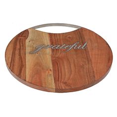 a wooden cutting board with the word grateful engraved on it's side and two sides