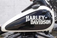 a harley davidson motorcycle parked in front of a building