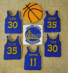 cookies made to look like basketball jerseys with the golden state warriors logo on them