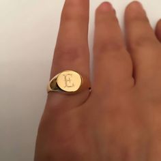 "Pinky ring, Engraved ring, Initial Ring, Personalized Ring Engraved Signet ring with Round Seal- Best quality 18k Gold Plate Engraved 1 letter - Vintage style Diameter: 0.7 mm = 0.27\" Please note in the \"notes to seller\" at checkout. : * state your ring size * letter you want to apper The product will arrive to you packed in gift box and padded envelope to maintain the product Our jewelry are water resistant and comes with 1 year warranty For more rings from us: https://www.etsy.com/il-en/sh Open Ring With Monogram, Personalized Open Ring Jewelry For Proposal, Personalized Open Ring For Proposal, Monogram Engraved Open Ring For Promise, Classic Open Ring With Name, Monogram Engraved Open Promise Ring, Vintage Personalized Open Ring, Custom Name Initial Ring As A Gift, Initials Engraved Round Promise Ring