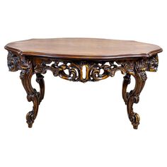 an ornate wooden table with carved carvings on it's legs and a wood top