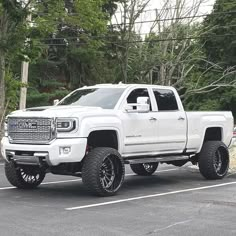 a white truck parked in a parking lot