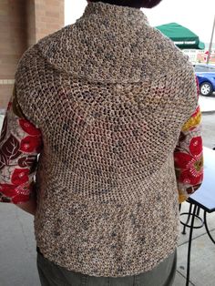 the back of a person wearing a knitted sweater