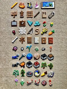 an array of pixel art pieces laid out on the floor in front of each other