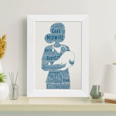 a framed blue poster with the words midwife on it