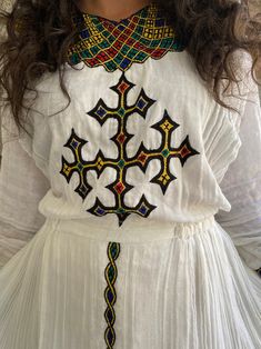 White Folk Style Habesha Kemis, Embroidered White Habesha Kemis, White Embroidered Fitted Habesha Kemis, Fitted White Embroidered Habesha Kemis, Traditional Embroidered Fitted Habesha Kemis, White Habesha Kemis With Woven Motifs For Traditional Ceremonies, Folk Style White Habesha Kemis For Festival, White Folk Habesha Kemis For Traditional Ceremonies, White Bohemian Habesha Kemis