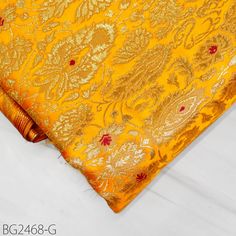 Yellow Brocade Fabric by the Yard Indian Banarasi Wedding Dress Bridesmaid Shift Dresses Double Breasted Coats Theatrical Historic Costumes. This is a beautiful multi color banarasi pure silk brocade in floral design fabric in multi color (Yellow with Deep Red) and Gold. ➤Product: Brocade Fabric ➤Fabric Type: Blended Silk (Viscose + Rayon and 30% Silk) Fine Quality Zari Brocade Weaving from Banaras ➤Color: Base color is Yellow with Deep Red and Gold. ➤Width: 44 Inches ➤Condition: New  ➤Code: bg2468-g ➤Listing for 1 Yard of fabric. ➤Care: Dry Clean Only Super Fine Quality Brocade Weaving from Banaras. During the Mughal period (1556-1707), when brocade was extremely popular with the rich, the great center of brocade weaving were Benares (Vārānasi). You can use this fabric to make Dresses, To Gold Traditional Drape Wear For Ceremony, Elegant Art Silk Fabric For Wedding, Gold Traditional Wear For Ceremony And Festivals, Gold Bollywood Traditional Wear For Ceremony, Elegant Wedding Fabric With Traditional Patterns, Gold Dupatta With Pallu For Ceremony, Ceremonial Brocade Traditional Wear With Pallu, Gold Banarasi Silk Fabric For Wedding, Elegant Wedding Art Silk Fabric