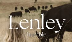 a woman standing next to a cow in a field with the words lenley on it