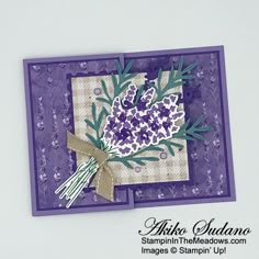 a close up of a card with flowers on the front and purple background that says, thank you