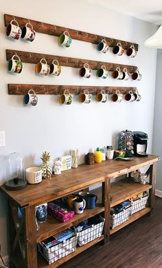 a coffee bar with cups hanging on the wall