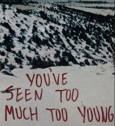 a sign that says you've seen too much too young on the side of a mountain