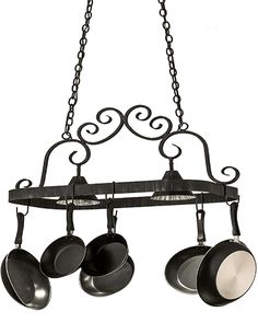 an iron pot rack with pans hanging from it's sides and two lights on each side