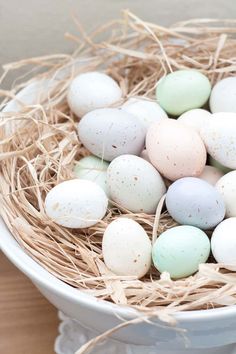 a white bowl filled with eggs on top of a wooden table