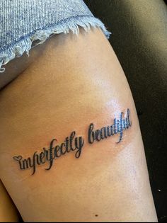 a woman's thigh with the word imperfectefeity beautiful written on it