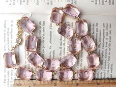 "Beautiful palest pink octagon crystals are like a ring of blushing roses around your neck. Each glass stone hand set and hand linked with high quality findings. Guaranteed to last a lifetime. Adjustable from 16 to 18\" with lobster claw and a 2\" extender. Each stone is 18 by 13mm, the perfect size to be seen and make a statement, but not too over the top big. Please see all of the photos for size reference. Beautiful for layering with my other pieces! Gift boxed and sent Priority mail. Need to Pink Faceted Beads Jewelry For Formal Occasions, Pink Formal Jewelry With Faceted Beads, Faceted Pink Jewelry For Formal Occasions, Pink Faceted Jewelry For Formal Occasions, Faceted Pink Jewelry For Wedding, Formal Faceted Pink Jewelry, Formal Pink Faceted Jewelry, Elegant Pink Faceted Crystal Necklace, Pink Faceted Party Jewelry