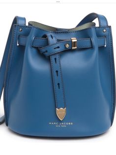 Authentic Marc Jacobs genuine leather blue small bucket bag. Condition is brand new mint condition tags attached been in climate controlled storage since purchasing never around smoke or animals please refer to photos for dimensions and specs. Goes perfect w just about any outfit. Dresses up a pair of jeans yet also works well for a formal night out. LAST ONE. Item is in hand Luxury Blue Shoulder Bucket Bag, Luxury Blue Bucket Bag, Leather Satchel Bucket Bag, Designer Blue Bucket Bag For Travel, Luxury Blue Bucket Bag For Daily Use, Luxury Blue Bucket Bag For Shopping, Modern Bucket Bag With Branded Hardware For Travel, Designer Blue Bucket Bag With Dust Bag, Modern Blue Bucket Bag