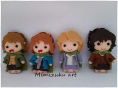 four little dolls are lined up in a row, one is wearing a coat and the other has a scarf