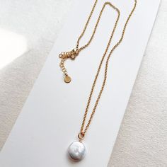 The Deene Necklace can be worn alone or layered with other pieces. A sleek and modern take on a classic, this necklace will quickly become your favorite! - Features a 1/2 inch coin pearl - Approximately 20 inches long with a 2-inch extender, making it very versatile - all pieces are 14K Gold Filled or Sterling Silver (for more information on our metals click HERE!) Elegant Pearl Necklace With Coin Pendant, Elegant Everyday Coin Necklace, Elegant Coin Necklace With Pearl Pendant, Elegant Gold Coin Necklace With Pearl Charm, Elegant Everyday Coin Pendant Necklace, Elegant Everyday Coin Necklace With Adjustable Chain, Coin Pearls, Layering Necklace, Ball Chain