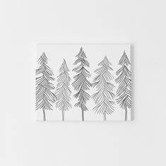 a black and white drawing of trees on a wall