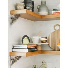 the shelves in the kitchen are filled with books and other things to cook for dinner