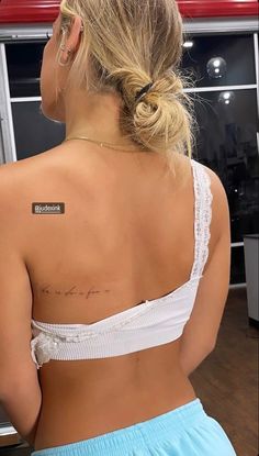 a woman with a small tattoo on her back