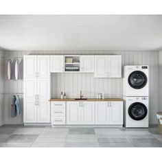 a washer and dryer in a white laundry room with gray tile flooring