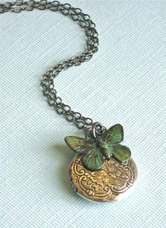 Small Silver Locket Necklace - Decorative Small Silver Ox Locket accented with a Verdigris Brass Butterfly. The Locket is 20 mm (slightly smaller than US nickel) and has a floral pattern. Stainless Steel Chain The patina on the butterfly will vary slightly from the one pictured. For other locket designs: http://www.etsy.com/shop/mcstoneworks/search?search_query=locket&search_submit=&search_type=user_shop_ttt_id_5402200&shopname=mcstoneworks Bohemian Butterfly Charm Jewelry For Gift, Green Wedding Locket Necklace, Adjustable Butterfly Charm Jewelry For Wedding, Green Vintage Charm Jewelry For Gift, Green Vintage Charm Jewelry Gift, Silver Bohemian Jewelry For Birthdays, Bohemian Silver Jewelry For Birthday, Bohemian Silver Jewelry For Birthdays, Green Pendant Jewelry For Birthday