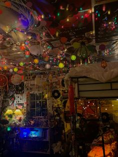 a room filled with lots of colorful lights and decorations hanging from the ceiling above it