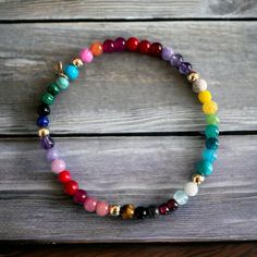 "Our happy Rainbow bracelet is bright and projects a feeling of happiness - made with a mix of gemstones such as: Malachite, Firestone, Turquoise, Coral, Jade, onyx, Amethyt, Rose Quartz, Tigereye, Garnet, Lapis etc. 14k solid gold beads are strung between the gemstones  Details: ✦ 14k solid gold Beads ✦ Stretch elastic ✦ 4mm gemstone beads ✦ 4mm solid gold beads  ✦ Our 14k gold is hallmared with VFD and 585 ( 14k) stamp ✦ NEW: Also available in Gold fill and Sterling silver ✦ Matching necklace Multicolor Gemstone Spiritual Stretch Bracelet, Spiritual Multicolor Gemstone Stretch Bracelet, Adjustable Multicolor Gemstone Stretch Bracelet, Multicolor Stackable Stretch Bracelet As Gift, Spiritual Rainbow Stretch Bracelet Gift, Spiritual Rainbow Stretch Bracelet As Gift, Spiritual Multicolor Gemstone Beads Stretch Bracelet, Rainbow Stretch Bracelet As A Gift, Rainbow Hand-strung Stretch Bracelet Gift