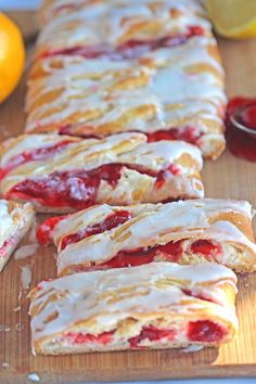 strawberry cream filled pastries on a cutting board