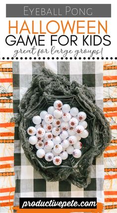 halloween game for kids with pumpkins and white balls in the center on an orange checkered tablecloth