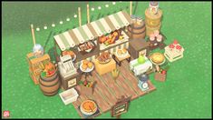 an image of a food stand in the middle of a green field with lots of food on it